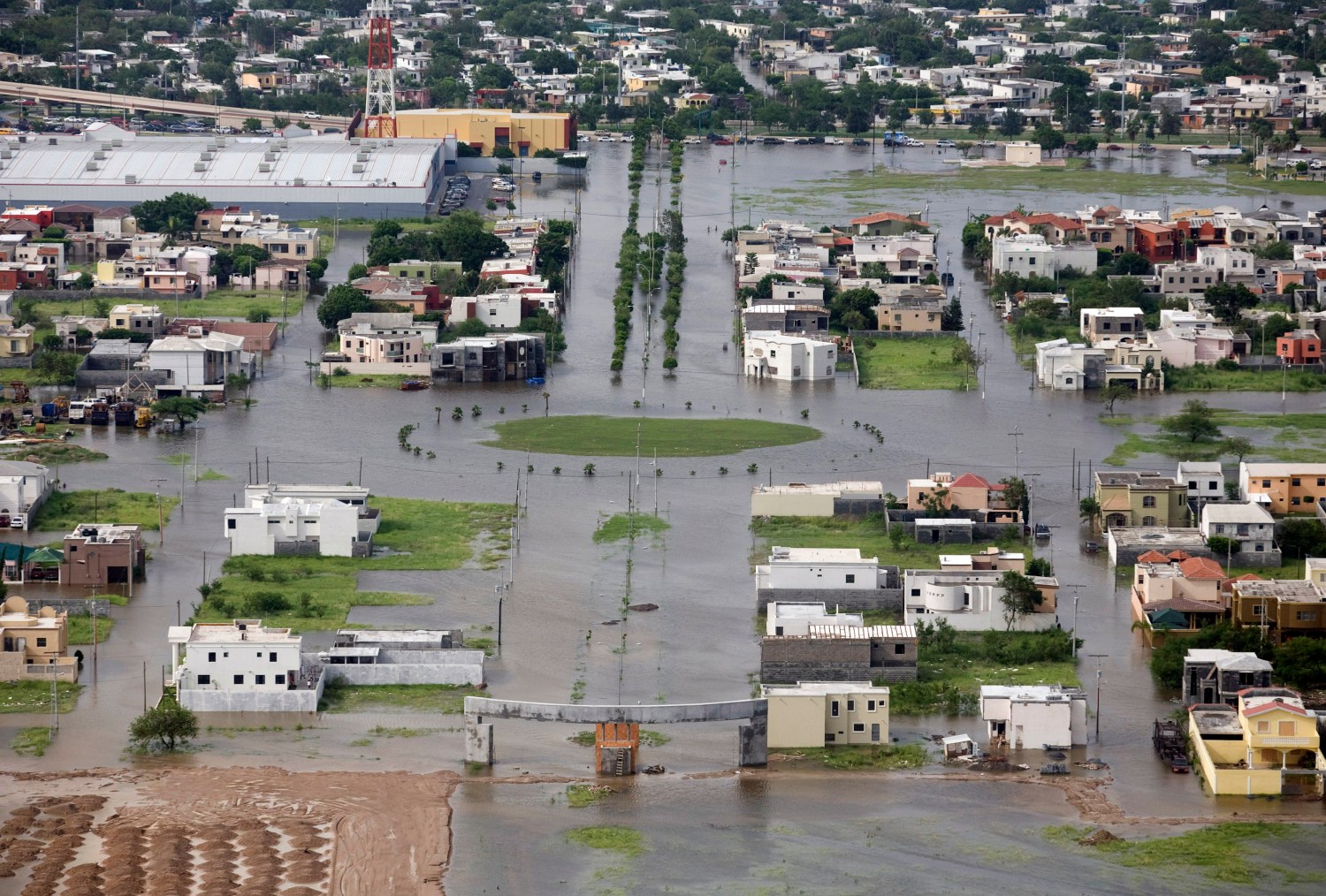 An aerial view of a flooded sector of the border city of Matamoros after being hit by Hurricane Dolly July 24, 2008. U.S. forecasters downgraded Dolly to a tropical depression on Thursday as it dissipated over South Texas. REUTERS/Tomas Bravo (MEXICO)