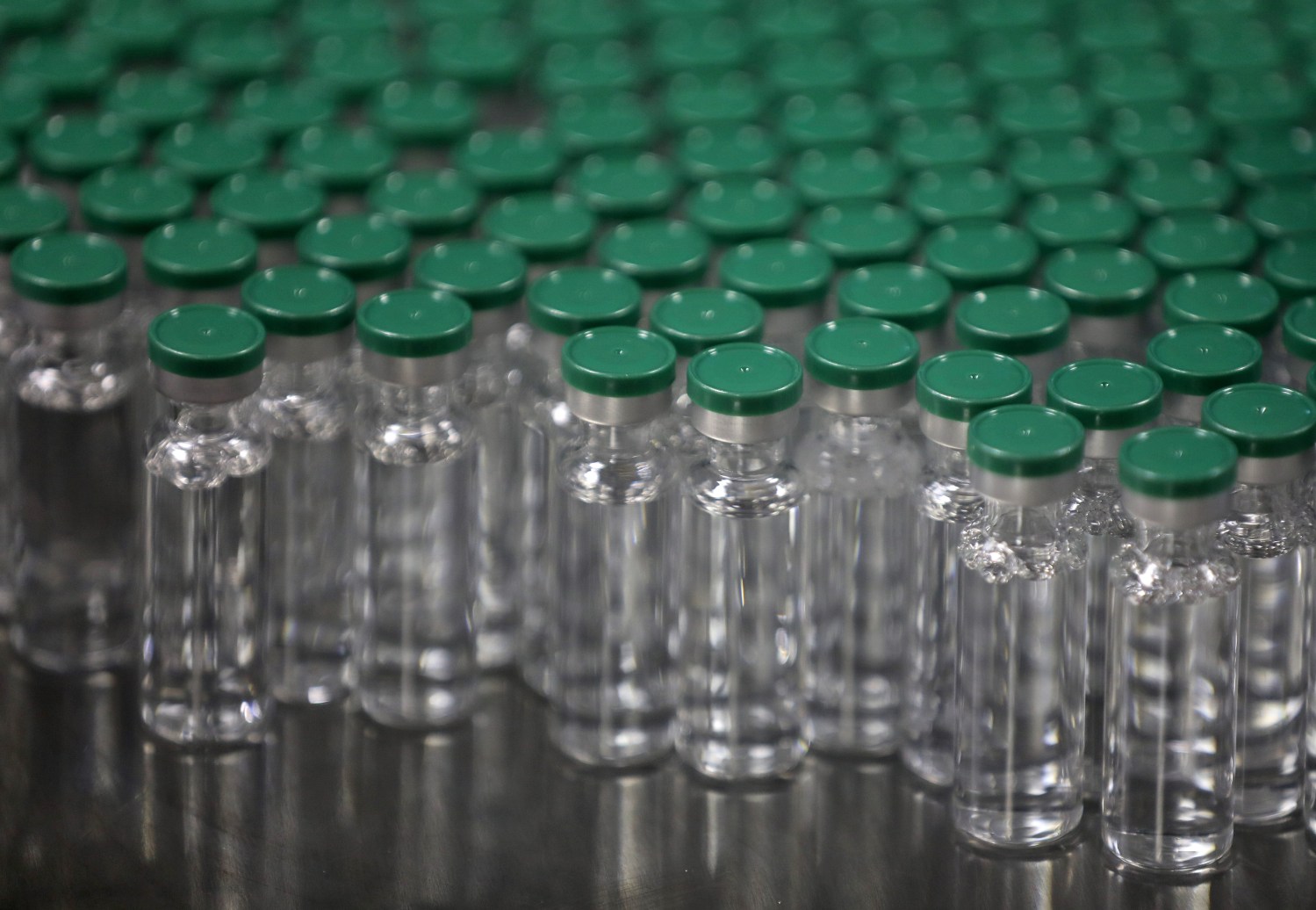 Vials of AstraZeneca's COVISHIELD, coronavirus disease (COVID-19) vaccine, are seen before they are packaged inside a lab at Serum Institute of India, Pune, India, November 30, 2020.  Picture taken November 30, 2020. REUTERS/Francis Mascarenhas