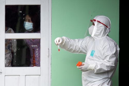 A medical staff wearing a protective suit works at a quarantine center amid the outbreak of the coronavirus diseases (COVID-19), in Yangon, Myanmar, October 5, 2020. REUTERS/Shwe Paw Mya Tin