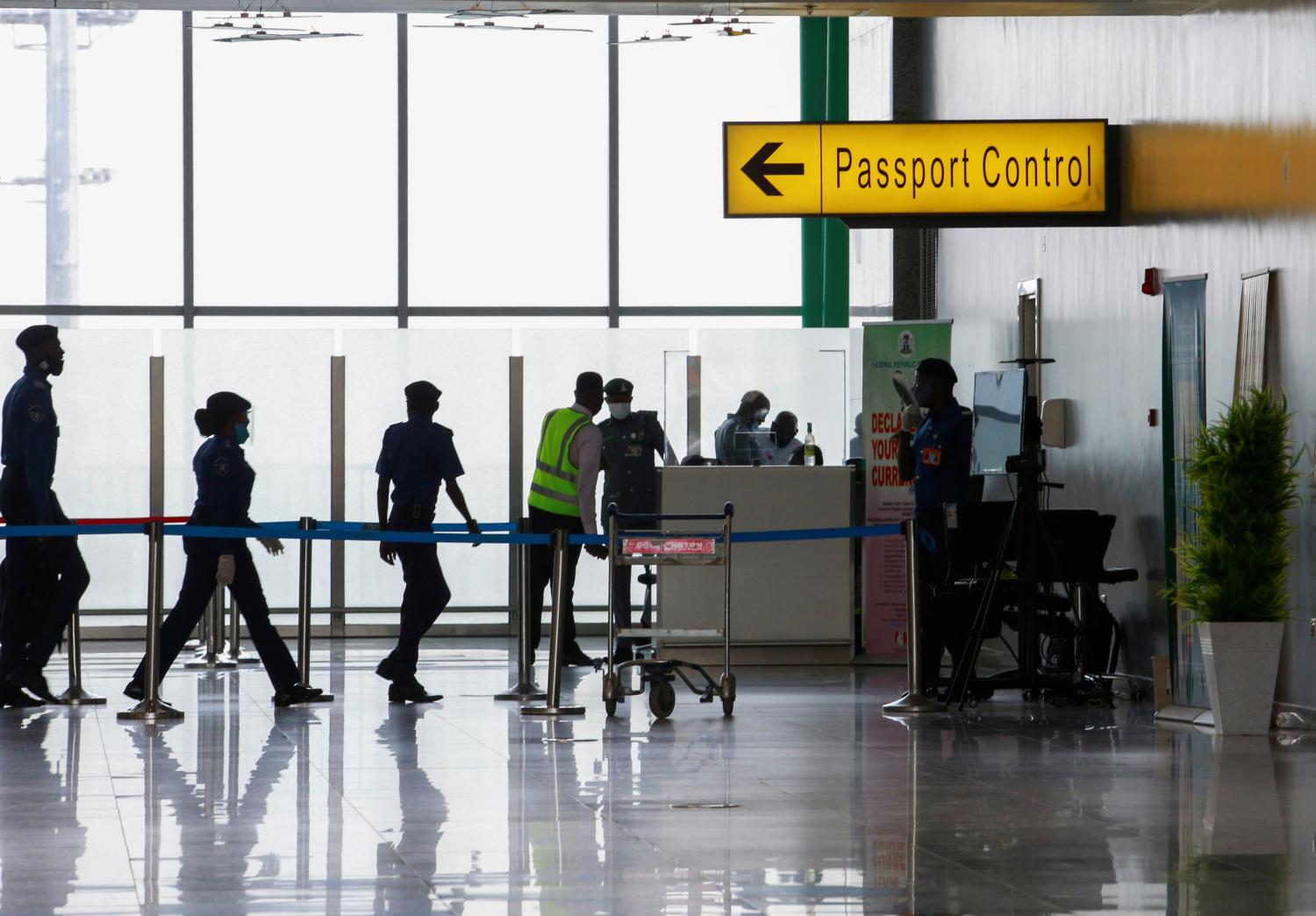 Security officers are seen at the passport control point at the Nnamdi Azikiwe international airport in Abuja, Nigeria September 7, 2020. REUTERS/Afolabi Sotunde