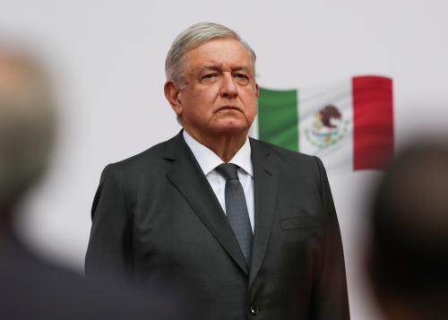 Mexico's President Andres Manuel Lopez Obrador listens to the national anthem as he arrives to address the nation on his second anniversary as President of Mexico, at the National Palace in Mexico City, Mexico, December 1, 2020. REUTERS/Henry Romero