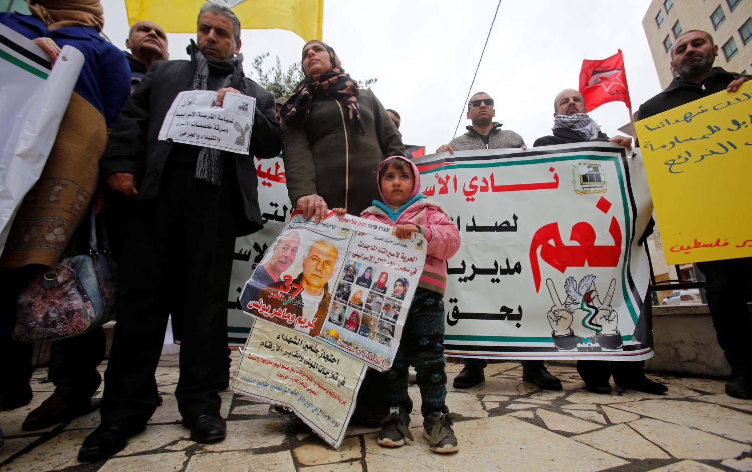 Palestinians protest against an Israeli decision to trim funds over prisoner stipends, in Hebron, in the Israeli-occupied West Bank, February 19, 2019. REUTERS/Mussa Qawasma