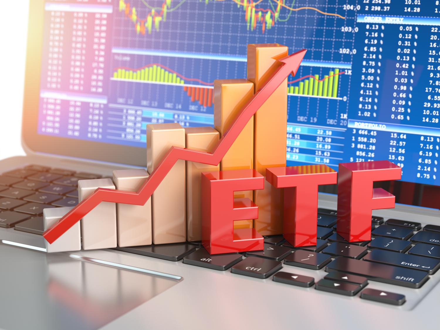 ETF exchange traded funds concept. Graph with ETF on the laptop keyboard with trade workstation app on the screen. 3d illustration