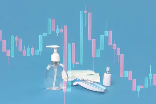 Stock market graph crash and hand sanitizer, flu mask, antibacterial soap and thermal scanner on blue. Personal hygiene and disinfection during viral pandemic and flu season financial markets response