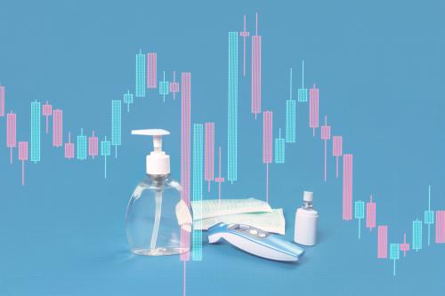 Stock market graph crash and hand sanitizer, flu mask, antibacterial soap and thermal scanner on blue. Personal hygiene and disinfection during viral pandemic and flu season financial markets response