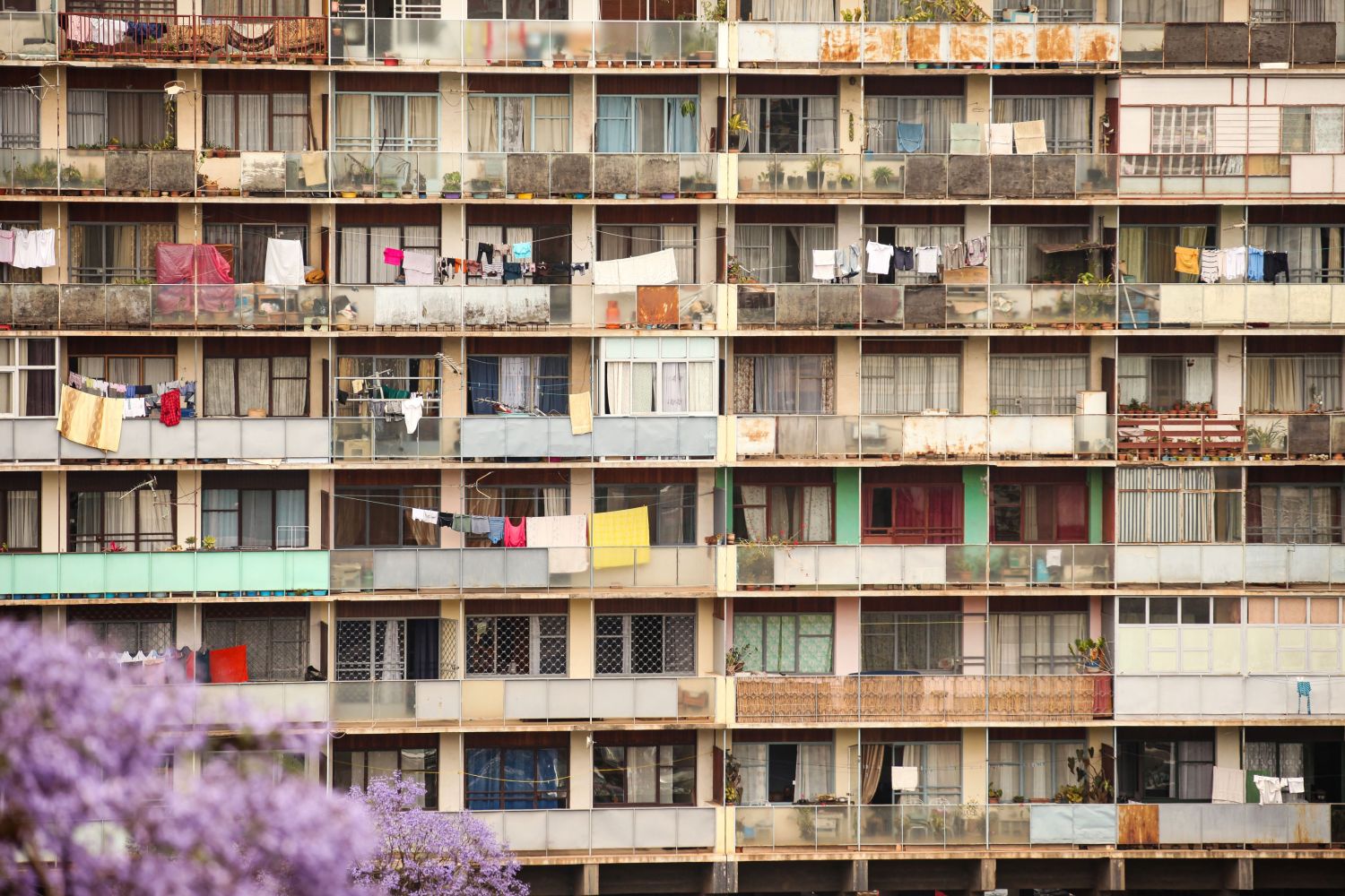Antananarivo / Madagascar - October 21, 2011: Laundry hangs on clothes lines on balconies of a run down high-rise apart.ment building