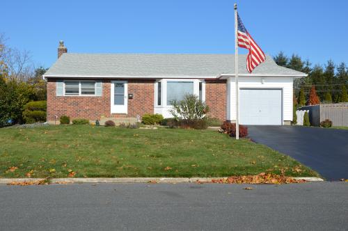 Suburban household with American flag.