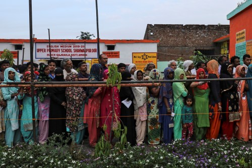 Voters line up to cast their votes outside a polling station during the second phase of general election in Amroha, in the northern Indian state of Uttar Pradesh, India, April 18, 2019. REUTERS/Anushree Fadnavis
