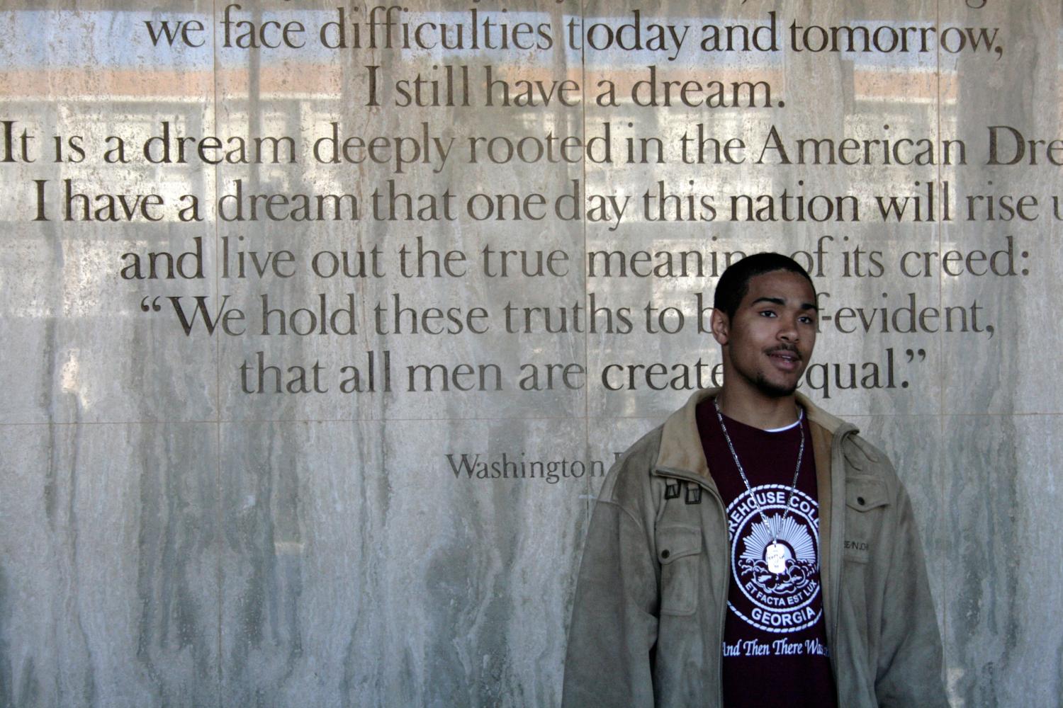 Thomas Coverson, 19, a freshman at Morehouse College in Atlanta, Georgia, explains his passion for the history of the civil rights movement in front of Martin Luther King Jr.'s famous "I Have a Dream" speech" at Martin Luther King Jr. International Chapel at Morehouse College in Atlanta, Georgia, January 8, 2009. Barack Obama's election as the first black U.S. president has rekindled interest in the U.S. civil rights struggles of the 1950s and 1960s at a time of continuing wide disparities in income, education and health care between whites and minority groups. Picture taken January 8, 2009. REUTERS/Andrea Shalal-Esa (UNITED STATES)