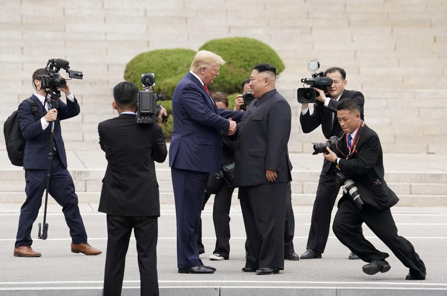 U.S. President Donald Trump meets with North Korean leader Kim Jong Un at the demilitarized zone separating the two Koreas, in Panmunjom, South Korea, June 30, 2019. REUTERS/Kevin Lamarque/File Photo SEARCH "GLOBAL POY" FOR THIS STORY. SEARCH "REUTERS POY" FOR ALL BEST OF 2019 PACKAGES. TPX IMAGES OF THE DAY.