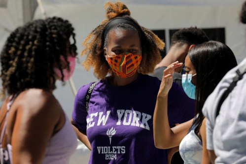 Students wear protective masks as they wait in line at a testing site for the coronavirus disease (COVID-19) set up for returning students, faculty and staff on the main New York University (NYU) campus in Manhattan, New York City, New York, U.S., August 18, 2020. REUTERS/Mike Segar