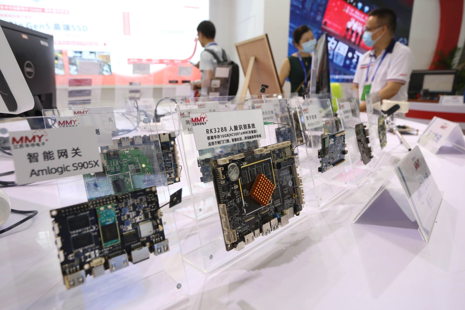 Semiconductor products are displaeyd on a white table at a conference in eastern China.