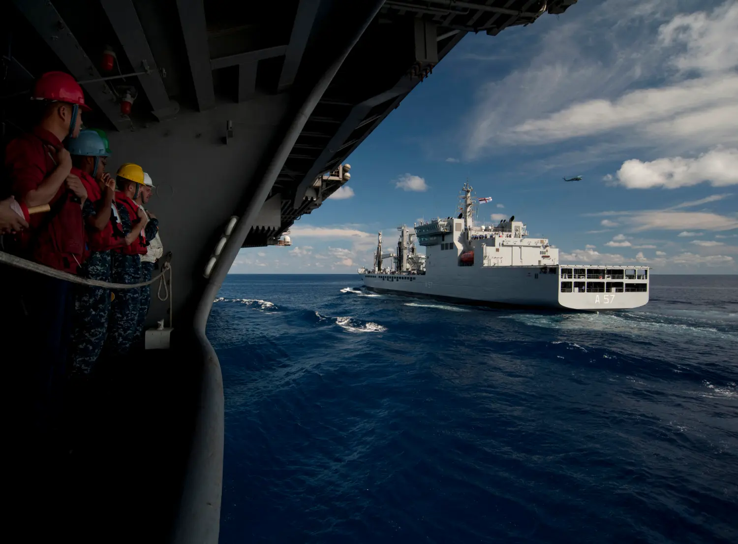 Handout file photo dated April 13, 2012 of sailors aboard the Nimitz-class aircraft carrier USS Carl Vinson (CVN 70) stand by as the ship goes alongside the Indian navy fleet oiler INS Shakti (A57) during a refueling at sea exercise. Carl Vinson and Carrier Air Wing (CVW) 17 are deployed participating in the Malabar Exercise with ships and aircraft from the Indian navy. Australia will join India, the United States and Japan in next month's Malabar naval exercises in the Indian Ocean, in a move that is expected to strengthen the military relationship between the four democracies amid increased tensions with China. Conducted annually since 1992, the maneuvers have grown in size and complexity in recent years to address what the US Navy has previously described as a "variety of shared threats to maritime security in the Indo-Asia Pacific." U.S. Navy photo by Mass Communication Specialist 2nd Class James R. Evans via ABACAPRESS.COM