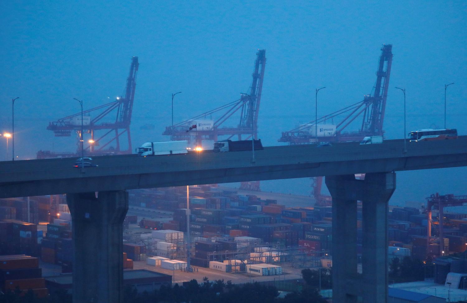 FILE PHOTO: Cranes and shipping containers are seen at Pyeongtaek port in Pyeongtaek, South Korea, July 9, 2020. REUTERS/Kim Hong-Ji