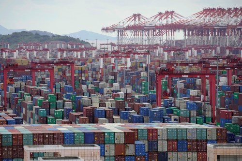 FILE PHOTO: Containers are seen at the Yangshan Deep-Water Port in Shanghai, China October 19, 2020. REUTERS/Aly Song