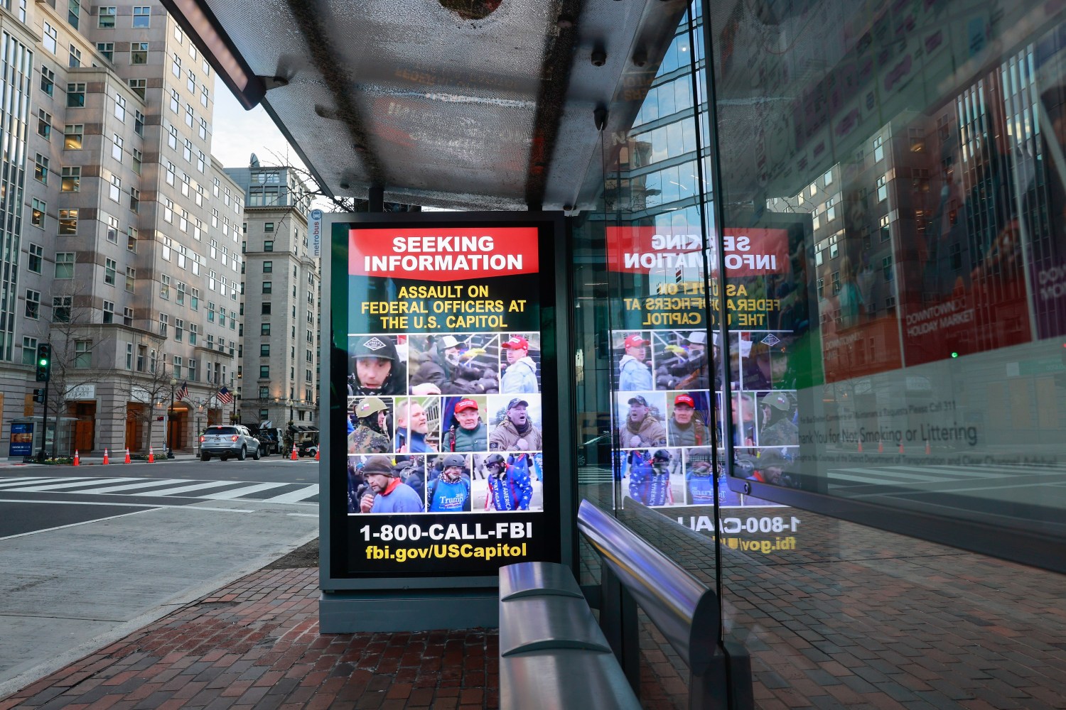 An electronic advertisement not far from the White House snows the faces of suspects who assaulted federal officers at the Capitol Building during the January 6, 2021 storming. The FBI is asking anybody with information about the whereabouts of the suspects to make contact with law enforcement. (Photo by Jeremy Hogan / SOPA Images/Sipa USA)No Use Germany.