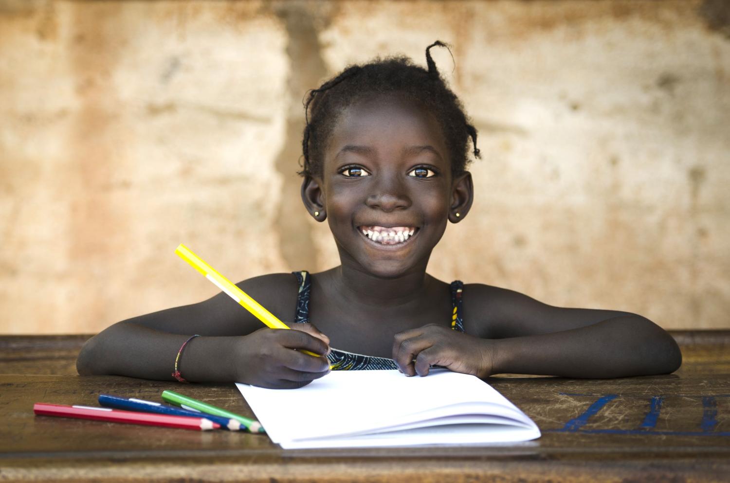 Girl student happily studying.