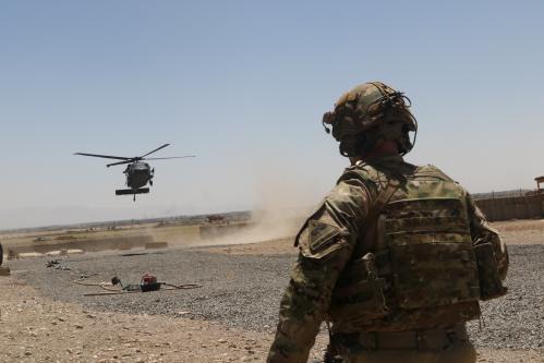 A U.S. soldier assigned to the Headquarters and Headquarters Battalion, 1st Armored Division watches as a UH-60 Blackhawk Helicopter prepares to land during an advise and assistance mission in southeastern Afghanistan, August 4, 2019.    Picture taken on August 4, 2019.   Courtesy Alejandro Licea/U.S. Army/Handout via REUTERS  ATTENTION EDITORS - THIS IMAGE HAS BEEN SUPPLIED BY A THIRD PARTY.