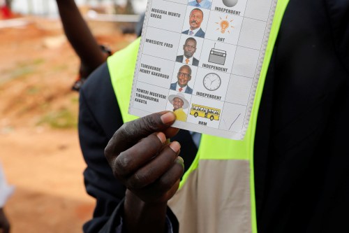 An election official shows a ballot after polling stations closed during the presidential elections in Kampala, Uganda, January 14, 2021. REUTERS/Baz Ratner