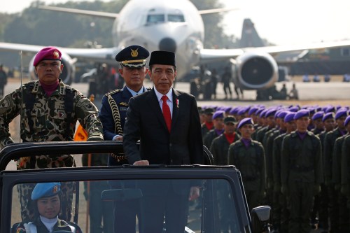 Indonesia's President Joko Widodo stands as he inspects soldiers during celebrations for the 74th Indonesian National Armed Forces day at Halim Perdanakusuma airbase in Jakarta, Indonesia, October 5, 2019. REUTERS/Willy Kurniawan