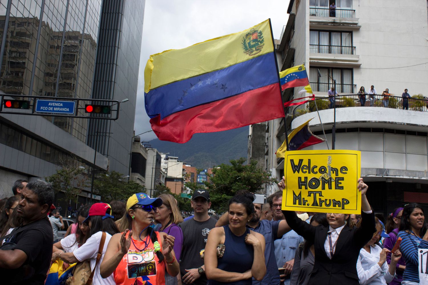 Caracas/Venezuela - January 30, 2019: Protesters hold banners welcoming Donald Trump aggressive moves on Venezuela and Juan Guaido, the U.S. backed opposition leader declared interim presiden