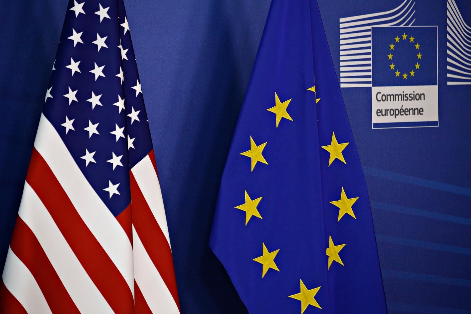 Flags for the European Union and United States.
