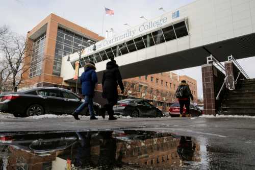 People walk outside Hostos Community College in the Bronx borough of New York, U.S., December 16, 2017.  REUTERS/Eduardo Munoz