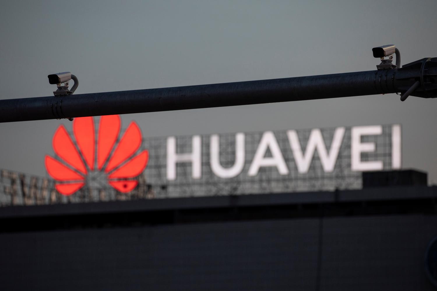 Surveillance cameras are seen in front of a Huawei logo in Belgrade, Serbia, August 11, 2020. Picture taken August 11, 2020. REUTERS/Marko Djurica