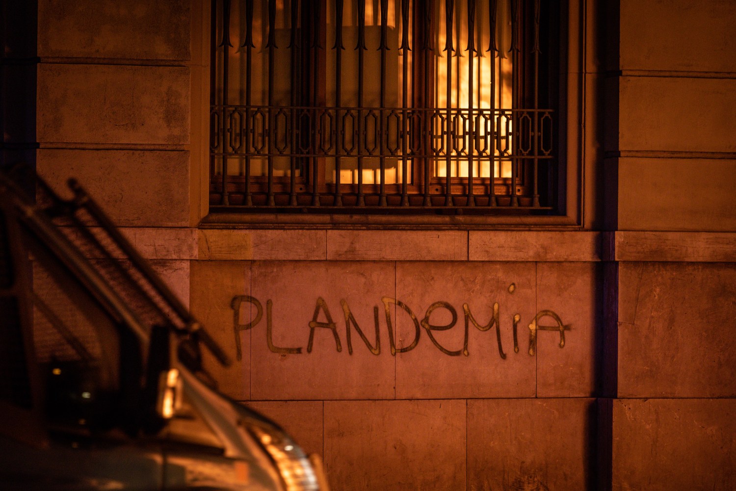 The word "plandemic" is painted on a wall in Barcelona, Spain, in protest against COVID-19 restrictions imposed by the Spanish government.