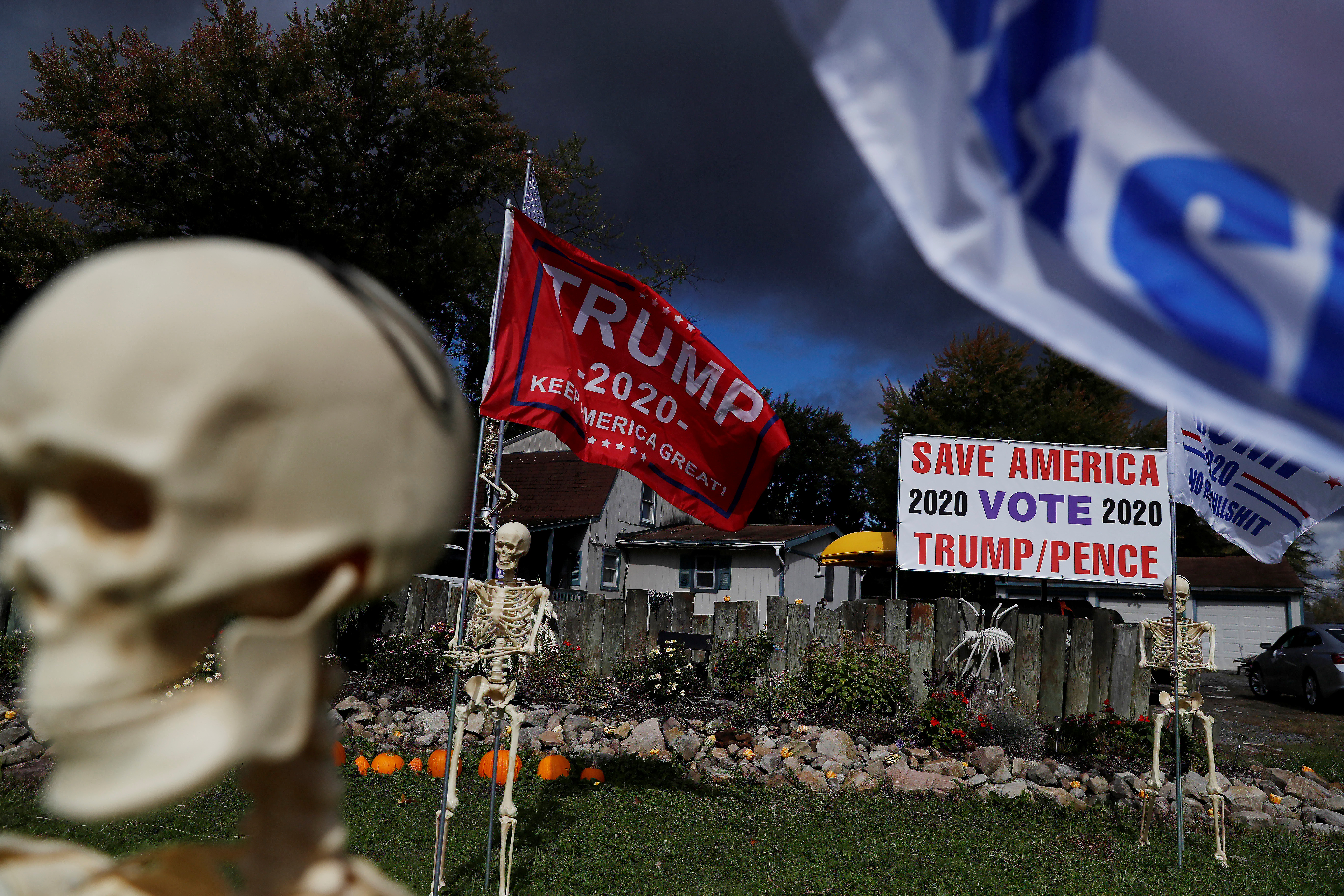 Halloween decorations and support for U.S. President Donald Trump are seen in the front of supporter Maranda Joseph's yard in Warren, Ohio, U.S., October 2, 2020. REUTERS/Shannon Stapleton