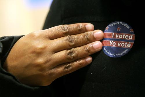 WASHINGTON D.C., UNITED STATES  NOVEMBER 2, 2020: A voter wears a bilingual I voted sticker at the University of the District of Columbia (UDC) during early voting in the 2020 US presidential election. Yegor Aleyev/TASS.No use Russia.