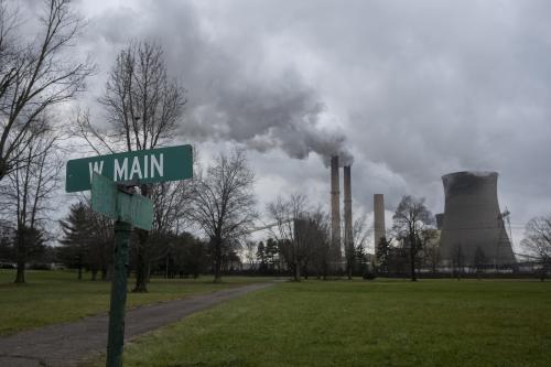 A coal power plant seen near the intersection of Main and Fourth streets on Monday, Dec. 21, 2020 in Cheshire, Ohio. In the early 2000s, this area was dotted with homes, but AEP bought out the town and several residents moved away after many environmental problems related to the power plant.01 Coal Plants