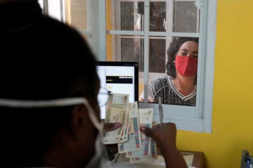 Odalys Paez waits to receive a remittance at a Western Union office, in Havana, Cuba, October 28, 2020.  REUTERS/Alexandre Meneghini