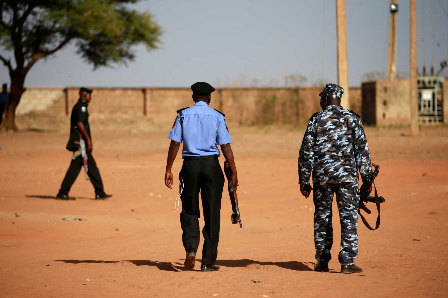 Police patrol inside the Government Science school in Kankara, in northwestern Katsina state, Nigeria December 13, 2020. Picture taken December 13, 2020. REUTERS/Afolabi Sotunde