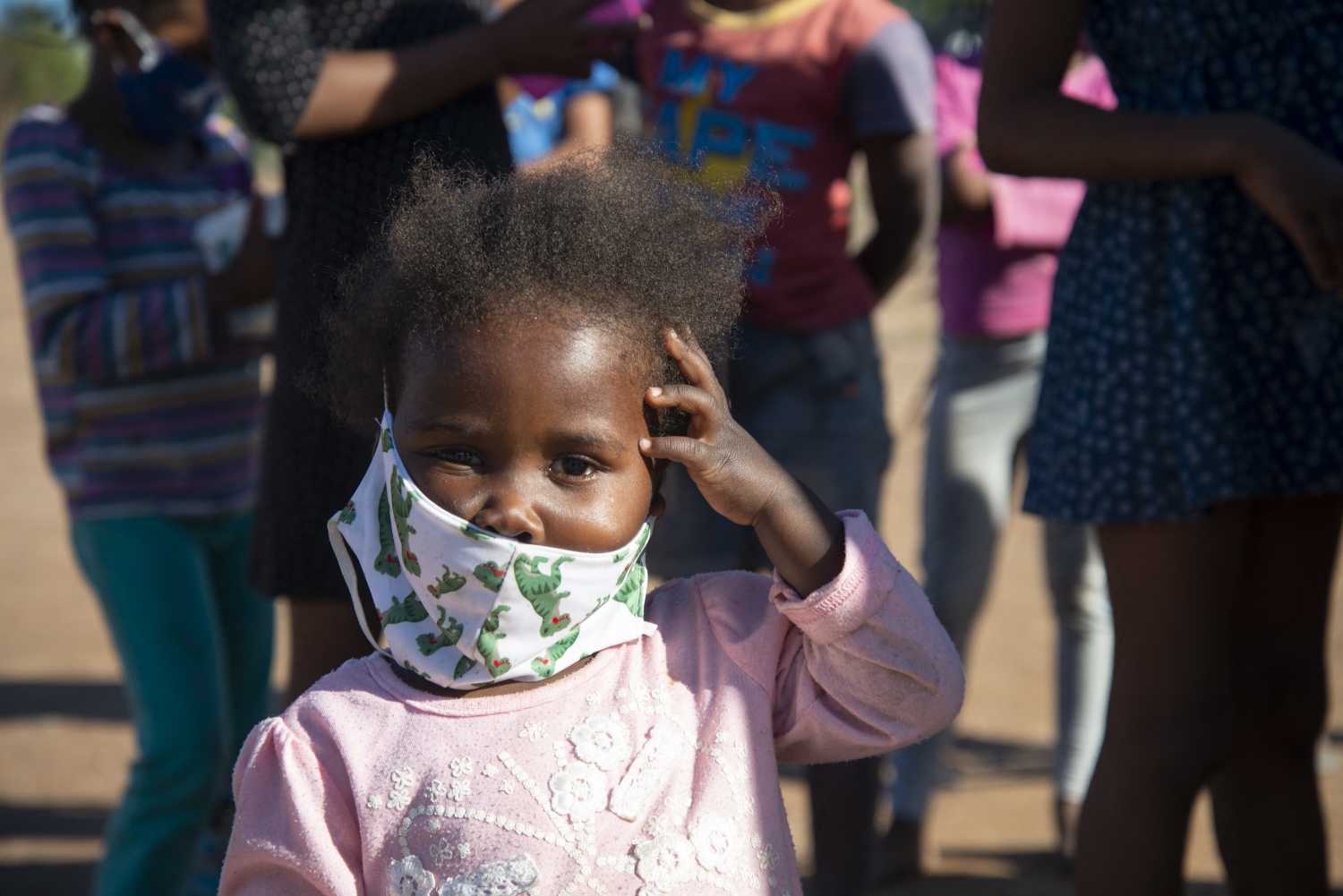 A small child wearing a facemask is seen at a volunteer food drive in Mountain View, an informal settlement in Jamestown, located in the Cape Winelands District, on Saturday, May 29, 2020. It's estimated that most, if not all, of the households here had no income, due to unemployement during lockdown. Cape Winelands is one of the districts in the Western Cape that has been designated a hotspot area, in terms of people testing positive for COVID-19. When South Africa moves down to Stage 3 of the nationwide lockdown on June 1st, hotspots areas will remain under stricter regulation and surveillance, per the latest government announcements. Photo by Eva-Lotta Jansson/RealTime Images/ABACAPRESS.COMNo Use South Africa.