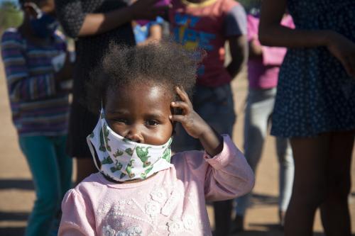 A small child wearing a facemask is seen at a volunteer food drive in Mountain View, an informal settlement in Jamestown, located in the Cape Winelands District, on Saturday, May 29, 2020. It's estimated that most, if not all, of the households here had no income, due to unemployement during lockdown. Cape Winelands is one of the districts in the Western Cape that has been designated a hotspot area, in terms of people testing positive for COVID-19. When South Africa moves down to Stage 3 of the nationwide lockdown on June 1st, hotspots areas will remain under stricter regulation and surveillance, per the latest government announcements. Photo by Eva-Lotta Jansson/RealTime Images/ABACAPRESS.COMNo Use South Africa.