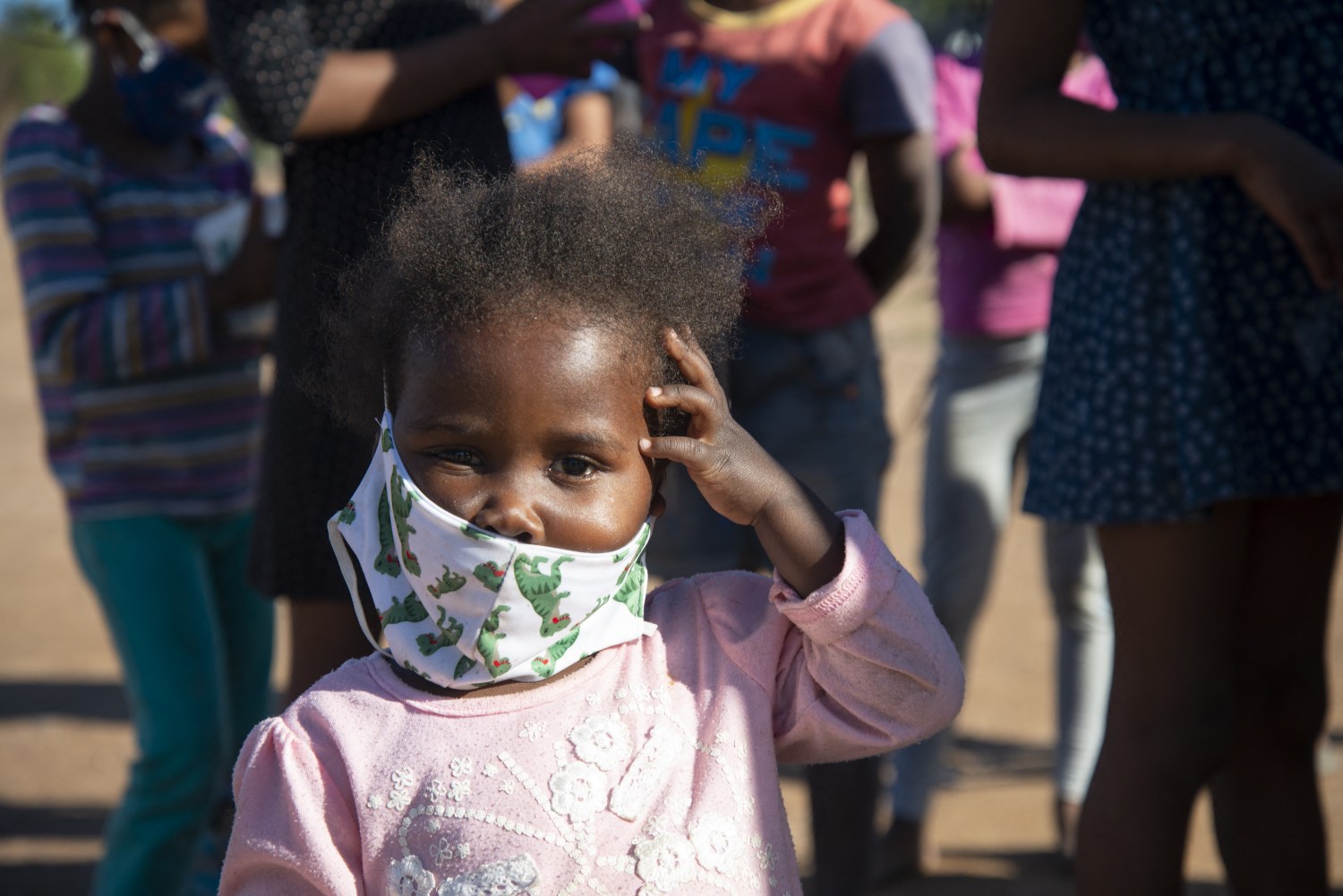 A small child wearing a facemask is seen at a volunteer food drive in Mountain View, an informal settlement in Jamestown, located in the Cape Winelands District, on Saturday, May 29, 2020. It's estimated that most, if not all, of the households here had no income, due to unemployement during lockdown. Cape Winelands is one of the districts in the Western Cape that has been designated a hotspot area, in terms of people testing positive for COVID-19. When South Africa moves down to Stage 3 of the nationwide lockdown on June 1st, hotspots areas will remain under stricter regulation and surveillance, per the latest government announcements. Photo by Eva-Lotta Jansson/RealTime Images/ABACAPRESS.COMNo Use South Africa.