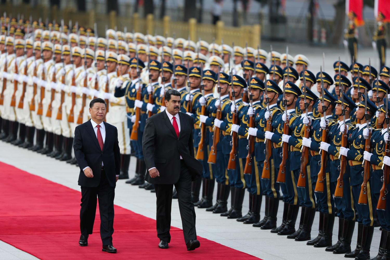 Chinese President Xi Jinping walks next to Venezuela's President Nicolas Maduro during his welcoming ceremony in Beijing, China September 14, 2018. Miraflores Palace/Handout via REUTERS ATTENTION EDITORS - THIS PICTURE WAS PROVIDED BY A THIRD PARTY
