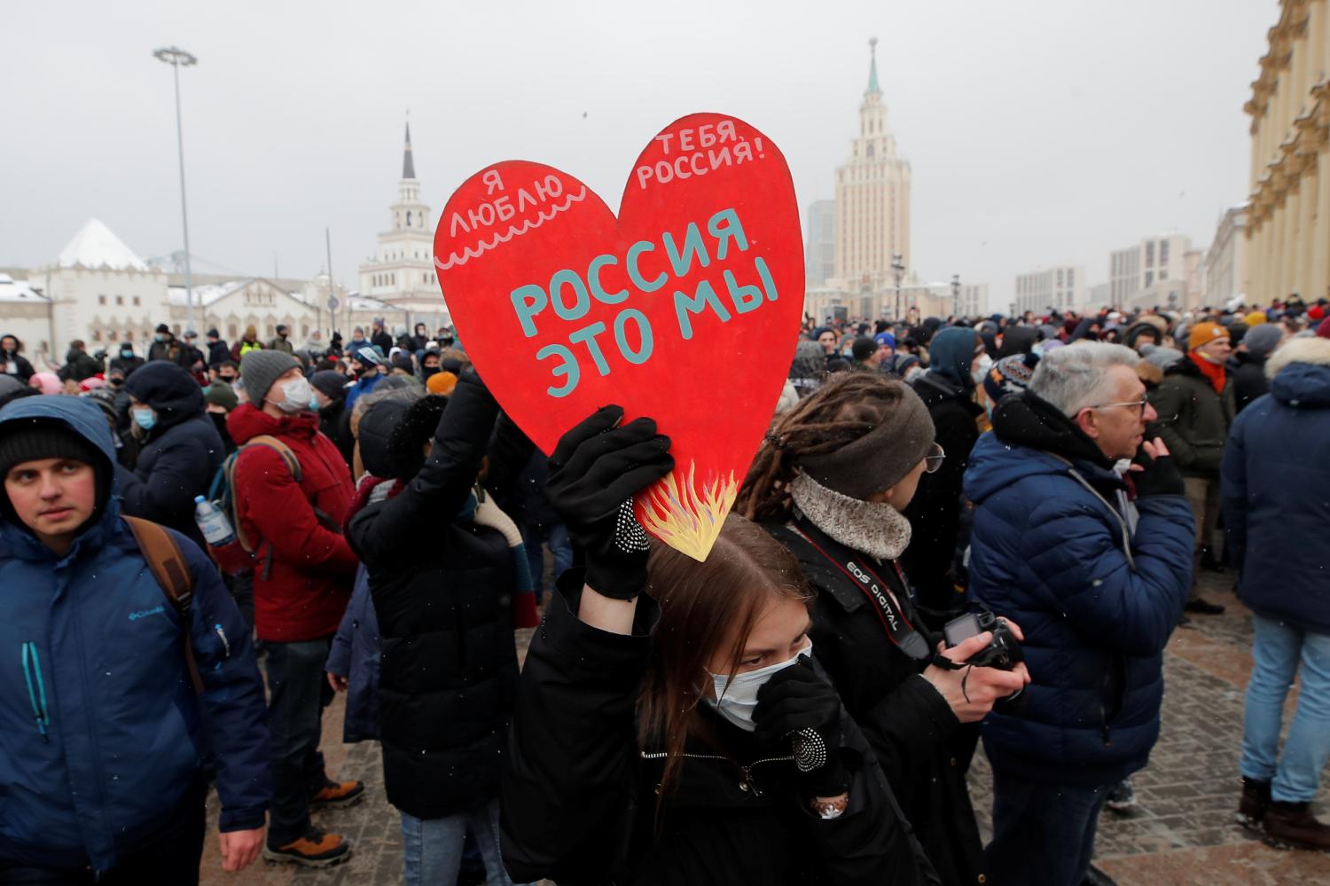 A protestor holds a heart-shaped sign reading "I love you, Russia! We are Russia!" during a rally in support of jailed Russian opposition leader Alexei Navalny in Moscow, Russia January 31, 2021. REUTERS/Maxim Shemetov