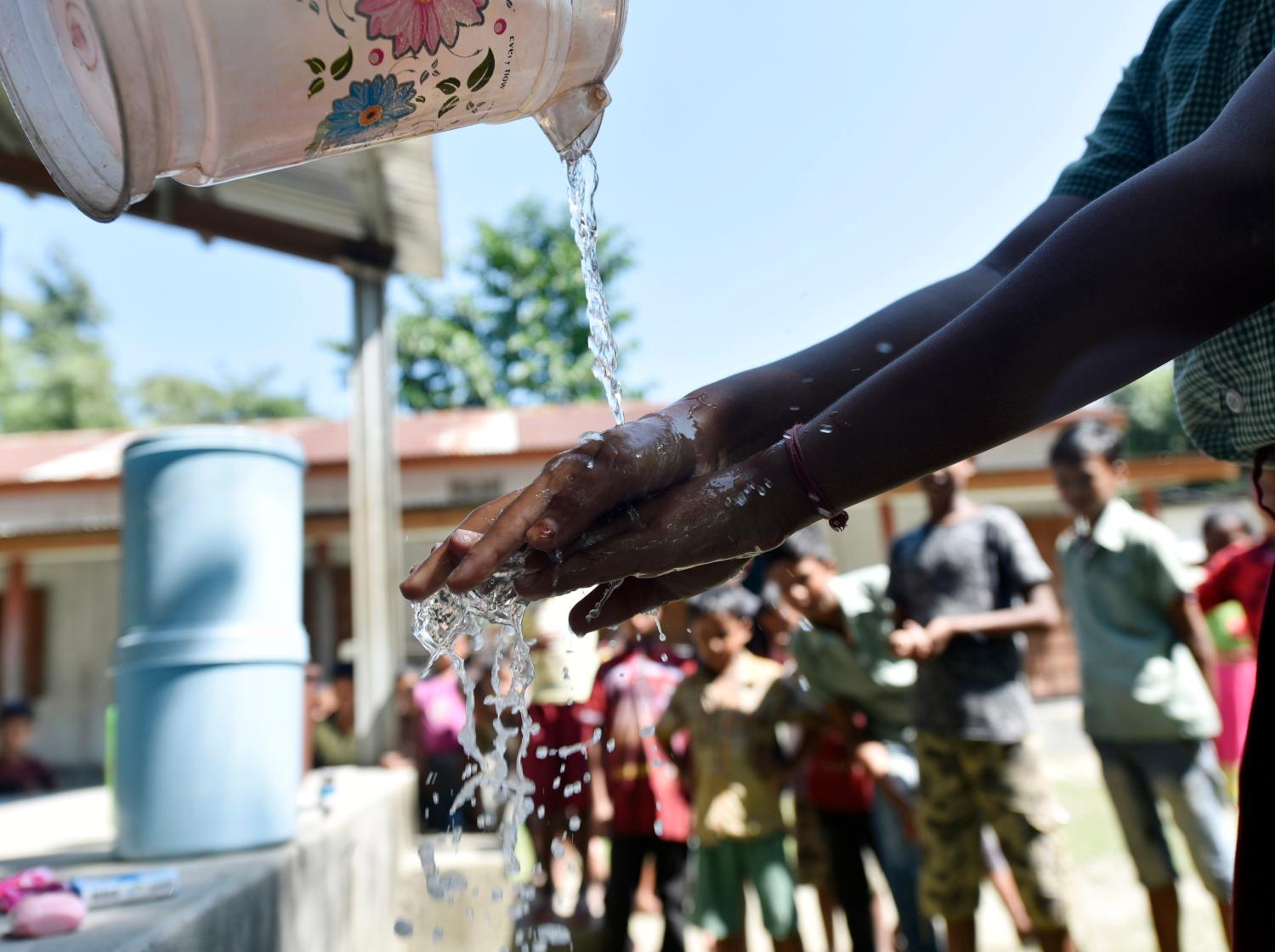 Barpeta, Assam, India. 15 October 2019. Children wash their hands during an event to mark Global Handwashing Day at a primary school on the outskirt of Guwahati.