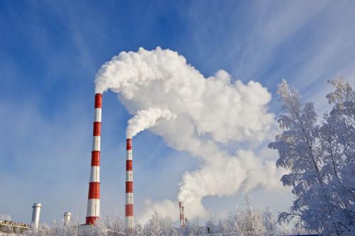 Emissions from flue-gas stacks of a thermal power station.