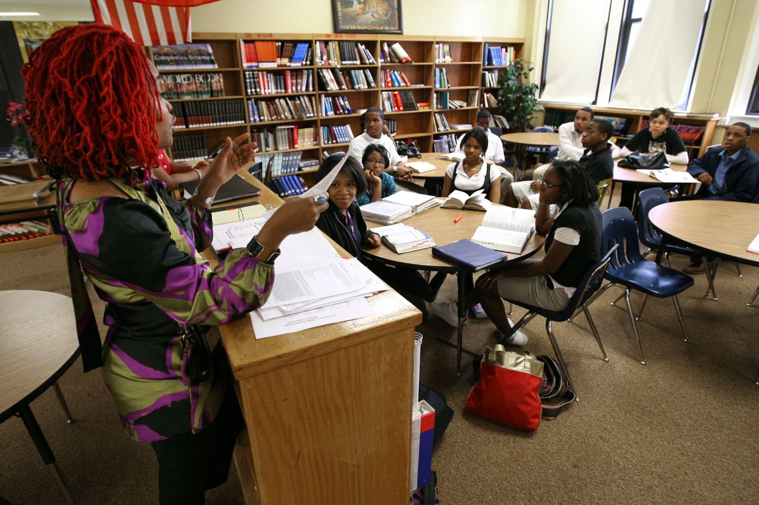 April 22, 2009 - Whitehaven High School's debate team is sending two people to the Chase National Urban Debate League Championships in Chicago. English teacher and debate coach Quintina Merriweather (Left) talks to team members in the school library.Ddebate1 2989509 2