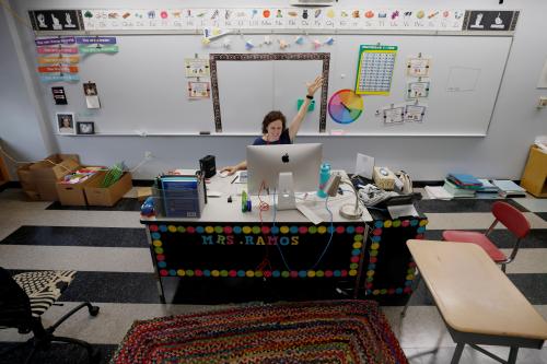 Teacher Jessica Crane greets her first grade students virtually from her classroom at the Kelly Elementary School on the first day of the new school year in a city hard hit by the coronavirus disease (COVID-19) outbreak, in Chelsea, Massachusetts, U.S., September 16, 2020.   REUTERS/Brian Snyder