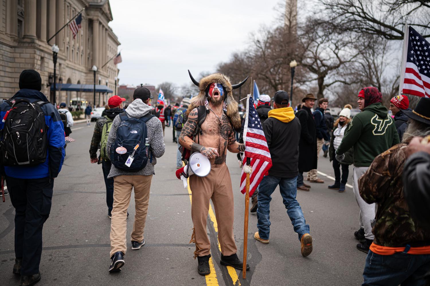 Jake Angeli, a QAnon influencer known as the “Q Shaman”, is seen among pro-Trump supporters during protests in Washington, D.C., on Jan. 6, 2021