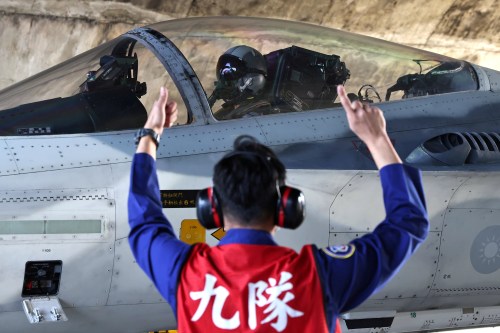 FILE PHOTO: A pilot prepares to take off on a F-CK-1 Ching-kuo Indigenous Defence Fighter (IDF) at an Air Force base in Tainan, Taiwan, January 26, 2021. REUTERS/Ann Wang/File Photo