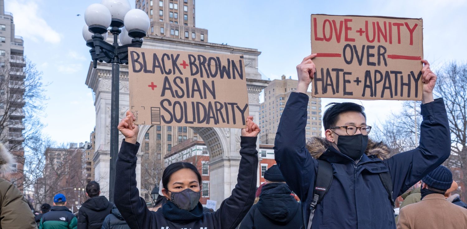 Protesters holding placards that read "black+brown+Asian solidarity" during the demonstration.End The Violence Towards Asians rally in Washington Square Park. Since the start of the coronavirus pandemic, violence towards Asian Americans has increased at a much higher rate than previous years. The New York City Police Department (NYPD) reported a 1,900% increase in anti-Asian hate crimes in 2020. (Photo by Ron Adar / SOPA Images/Sipa USA)No Use Germany.