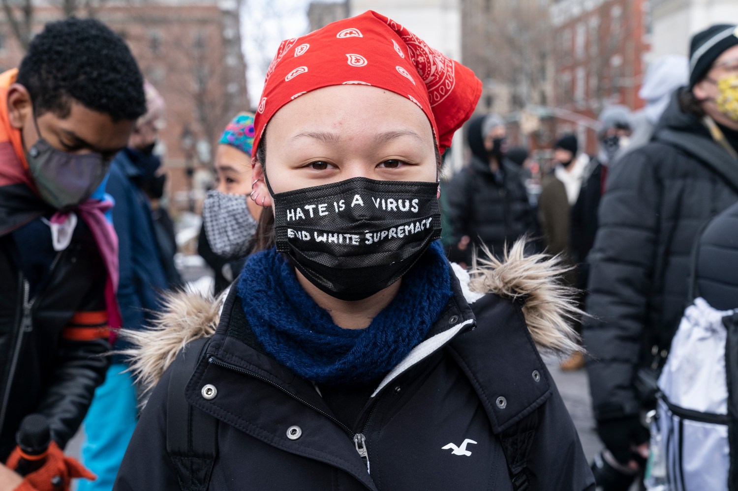 More than 200 people gathered on Washington Square Park to rally in support Aisian community, against hate crime and white nationalism. Rally held in New York on February 20, 2021. Rally was organized by ANTIFA (anti-fascist movement) and Abolitionist Community. A woman wears mask with message 'Hate is A Virus End White Supremacy'. (Photo by Lev Radin/Sipa USA)No Use Germany.