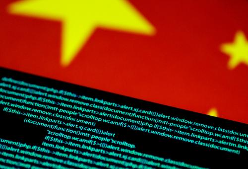 FILE PHOTO: Computer code is seen on a screen above a Chinese flag in this July 12, 2017 illustration photo.   REUTERS/Thomas White/Illustration/File Photo