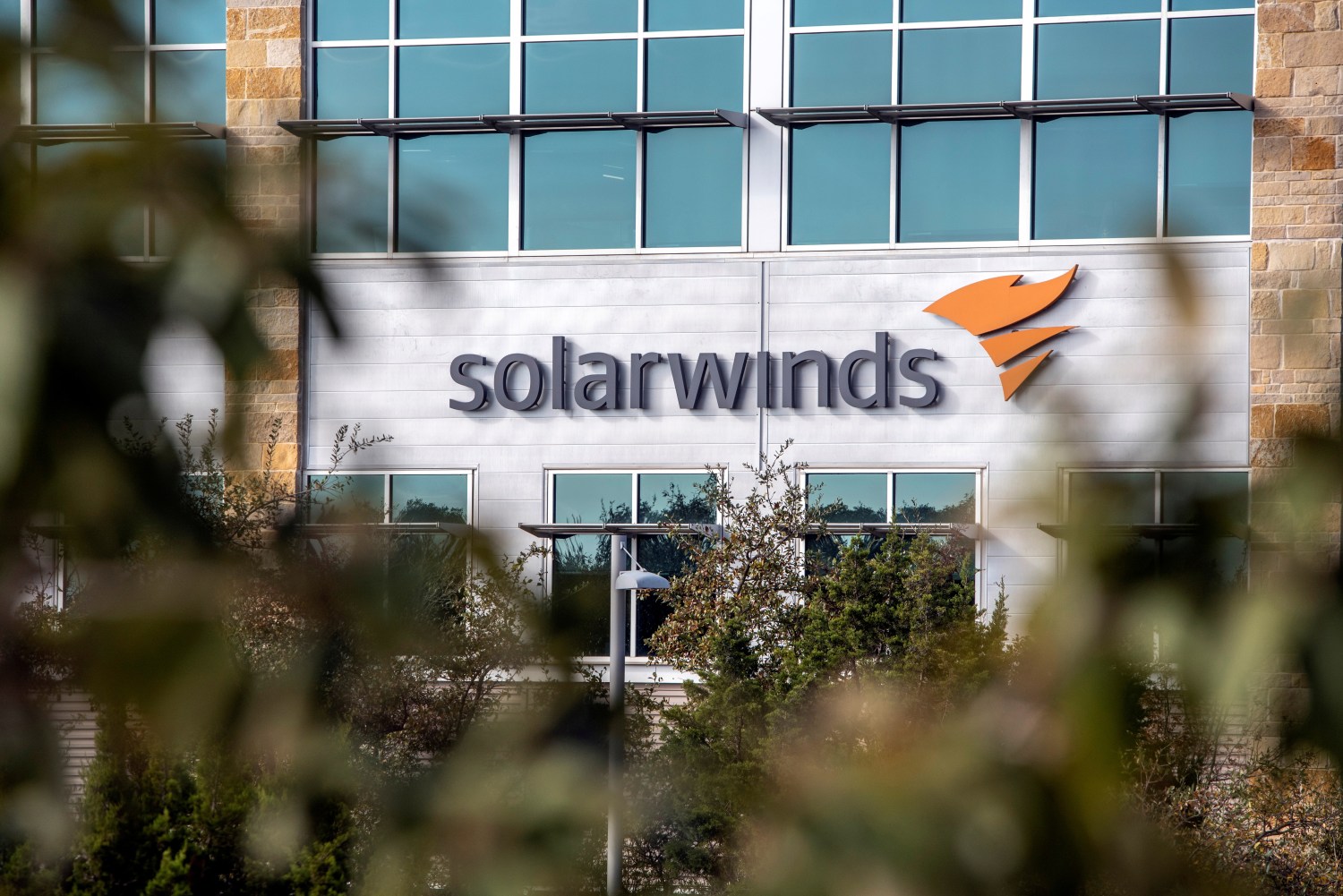The logo of network management company SolarWinds is displayed on the facacde of its corporate headquarters in Austin, Texas.