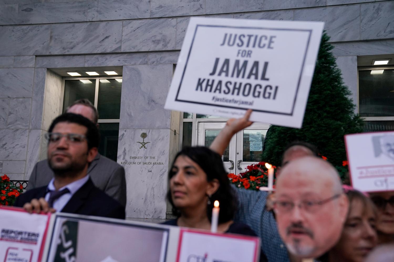 FILE PHOTO: The Committee to Protect Journalists and other press freedom activists hold a candlelight vigil in front of the Saudi Embassy to mark the anniversary of the killing of journalist Jamal Khashoggi at the kingdom's consulate in Istanbul, Wednesday evening in Washington, U.S., October 2, 2019. REUTERS/Sarah Silbiger/File Photo